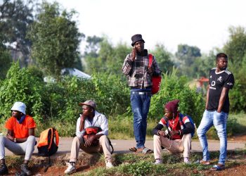 FILE PHOTO: Job seekers wait beside a road for casual work offered by passing motorists in Eikenhof, south of Johannesburg, South Africa, March 3, 2022. REUTERS/Siphiwe Sibeko/File Photo
